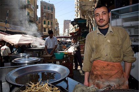 Un commerçant mans son étal du marché à Alexandrie, Égypte Photographie de stock - Rights-Managed, Code: 862-03352872