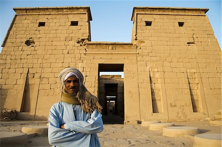 east bank - A temple guardian stands in front of the Temple of Khonsu at Karnak Temple,Luxor,Egypt Stock Photo - Rights-Managed, Code: 862-03352895