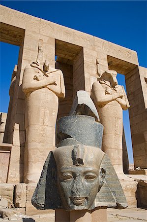 simsearch:862-03352903,k - Headless statues of Ramses II line the courtyard at the entrance to the Ramesseum,Luxor,Egypt Stock Photo - Rights-Managed, Code: 862-03352912