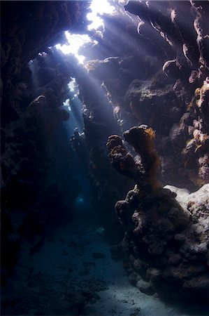 simsearch:862-03437028,k - Egypt,Red Sea. Shafts of sunlight penetrate the gloom in an underwater cave system at St. John's Reef,Red Sea. Stock Photo - Rights-Managed, Code: 862-03352941