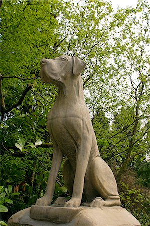 sir arthur conan doyle - Hound guarding entrance to Hayford Hall,which is reputed to have been the inspiration for the Baskerville Hall in Sir Arthur Conan Doyle's famous Sherlock Holmes detective novel Hound of the Baskervilles. Stock Photo - Rights-Managed, Code: 862-03353134