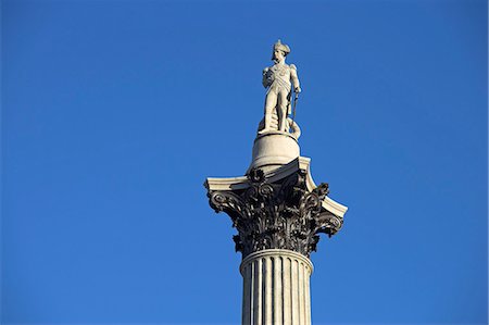 The statue of Lord Nelson stands atop Nelson's Column in Trafalgar Square. The statue was sculpted by EH Bailey. The column stands 145ft tall,the same hight as the masthead of HMS Victory,Nelson's flagship. Stock Photo - Rights-Managed, Code: 862-03353211