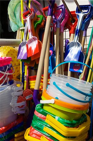 sea shore shops - Children's buckets and spades for sale at a shop at the old Cornish fishing village of Mousehole,Cornwall,England Stock Photo - Rights-Managed, Code: 862-03353331