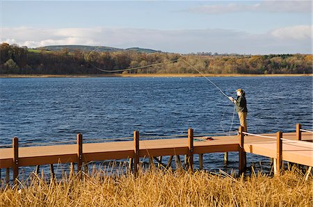 enniskillen - UK,Northern Ireland,Fermanagh. A fisherman fly fishing on Lough Erne . Fotografie stock - Rights-Managed, Codice: 862-03353377