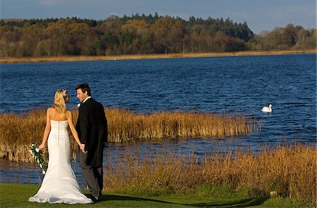 United Kingdom,Northern Ireland,Fermanagh,Enniskillen. Bride and groom by the lake during their wedding at the Lough Erne Golf Resort Hotel. . Stock Photo - Rights-Managed, Code: 862-03353435