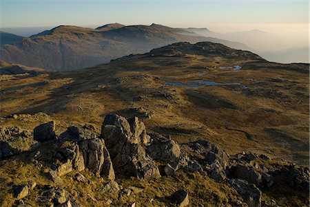 England,Cumbria,Lake District. Walkers traversing the Langdale Pikes,in Langdale. Stock Photo - Rights-Managed, Code: 862-03353599