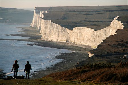 England,East Sussex,Beachy Head. Beachy Head is a chalk headland on the south coast of England,close to the town of Eastbourne. The cliff there is the highest chalk sea cliff in Britain,rising to 162 m (530 ft) above sea level. The peak allows views of the south east coast from Dungeness to the east,to Selsey Bill in the west. Stock Photo - Rights-Managed, Code: 862-03353592