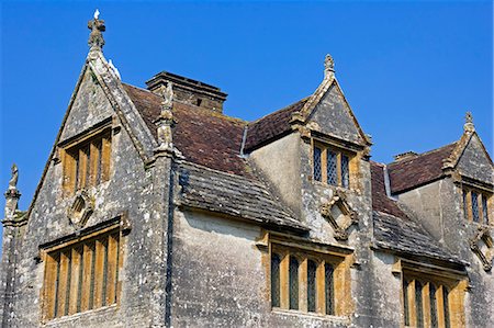 stately house - England,Dorset. Athelhampton House is one of the finest examples of 15th century domestic architecture in the country. Medieval in style predominantly and surrounded by walls,water features and secluded courts. Stock Photo - Rights-Managed, Code: 862-03353622