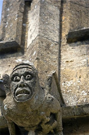 England,Somerset,Crewkerne. St Bartholomew's Parish Church stands on higher ground west of the town centre,it is the focal point of the rural prospect of the western side of the town a superb example of the Perpendicular style with many unusual and individual features - highlighted here are its highly individual gargolyes or more correctly its chimera. Stock Photo - Rights-Managed, Code: 862-03353665