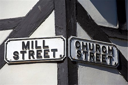 England,Gloucestershire,Tewkesbury. Road names reflecting the historic usage as Church Street meets Mill Street in the centre of the ancient town of Tewkesbury. Stock Photo - Rights-Managed, Code: 862-03353813