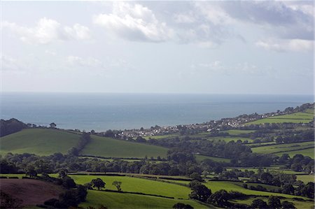 England,Dorset,Coney Castle. Coney's Castle is an Iron Age hill fort and affords superb views over the surrounding countryside and towards the UNESCO World Heritage Jurassic Coastline and the coastal town of Charmouth. Stock Photo - Rights-Managed, Code: 862-03353873