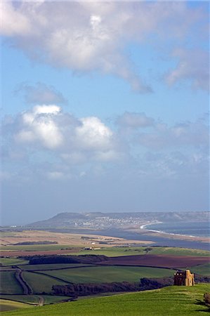 England,West Dorset,St Catherine's Chapel,Abbotsbury. Set high on a hilltop overlooking Abbotsbury Abbey,The Fleet and the UNESCO listed Jurassic Coastline,this sturdily buttressed and barrel-vaulted 14th-century chapel was built by the monks as a place of pilgrimage and retreat. Stock Photo - Rights-Managed, Code: 862-03353880