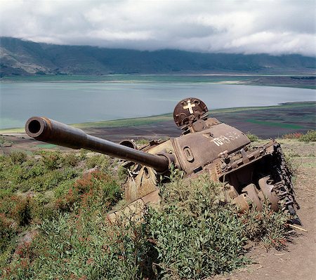 ethiopia landscape - The defeated forces of the former Ethiopian dictator,Mengistu Haile Mariam,left behind this wrecked Russian-made tank near Lake Ashange in northern Ethiopia.Africa's regional and ethnic wars divert scarce resources away from urgent development projects that could uplift the living standards of the people.. Stock Photo - Rights-Managed, Code: 862-03353962