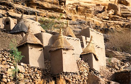 dogon - Granary structure and house in Dogon Village at the base of the Bandiagara plateau,designated a UNESCO World Heritage Site in 1989 Stock Photo - Rights-Managed, Code: 862-03364065