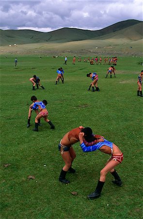 Mongolia,Ulan Bator. Boys competing in a wrestling competition at the National Day (Naadam) celebrations known as the 'three manly games'. Stock Photo - Rights-Managed, Code: 862-03364539
