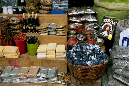 Beauty products including henna paste and leaves,silver blocks of antimony,rhassoul and kohl products laid out on a market stall in the Souk au Henne Stock Photo - Rights-Managed, Code: 862-03364584