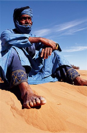 Berber tribesman in the sand dunes of the Erg Chegaga,in the Sahara region of Morocco. Stock Photo - Rights-Managed, Code: 862-03364600