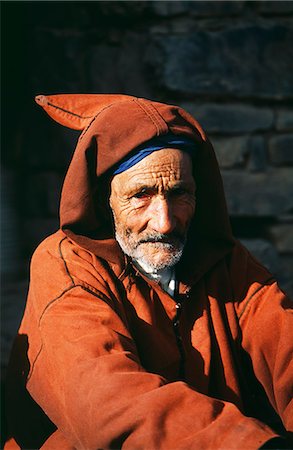 Caid (chieftain) outside of kasbah in the village of Roglglt,High Atlas Mountains,Southern Morocco. Stock Photo - Rights-Managed, Code: 862-03364615