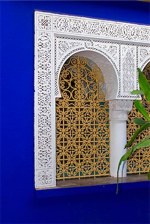 Morocco,Marrakech. An intricately carved arched window in Marrakech. Stock Photo - Rights-Managed, Code: 862-03364878