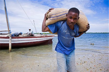 dhow boat - Unloading a dhow in the harbour of Ibo Island,part of the Quirimbas Archipelago,Mozambique Stock Photo - Rights-Managed, Code: 862-03364917