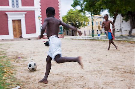 Boys play football among the crumbling colonial mansions on Ilha do Mozambique Stock Photo - Rights-Managed, Code: 862-03364990