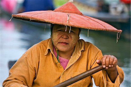 flat-bottomed boat - Myanmar. Burma. Lake Inle. A Burmese woman at the floating market of Ywa-ma on Lake Inle. Stock Photo - Rights-Managed, Code: 862-03365138