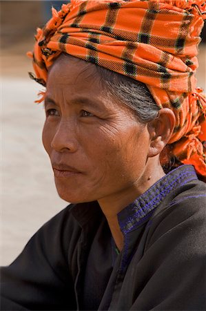 Myanmar. Burma. Pwehla. A Pa-O woman in typical attire. The Pa-O are also known as the dragon people because their layers of black clothing resemble the scales of a dragon. Stock Photo - Rights-Managed, Code: 862-03365133