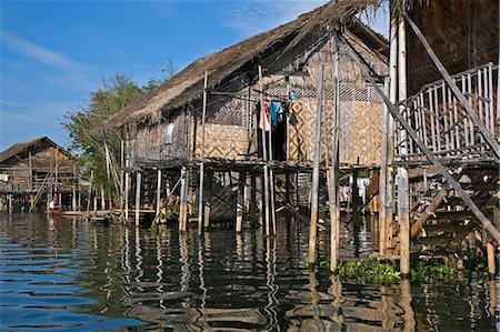 Myanmar,Burma,Lake Inle. Typical Intha houses on stilts in Lake Inle. The patterned walls are made of woven bamboo. Stock Photo - Rights-Managed, Code: 862-03365170