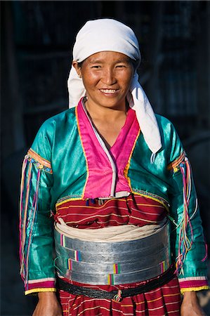 Myanmar. Burma. Wanpauk village. A Palaung woman of the Tibetan-Myanmar group of tribes. Women commonly display their wealth by wearing broad silver belts. Stock Photo - Rights-Managed, Code: 862-03365205