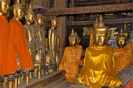 Myanmar,Burma,Kengtung. Statues of Buddha in the Wat In monastery at Kengtung. Chinese influence is evident from the Buddhas’ eyes. Stock Photo - Rights-Managed, Code: 862-03365257