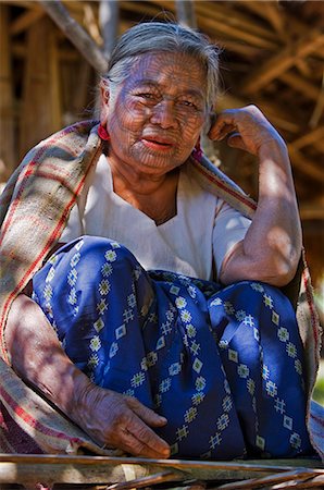 Myanmar,Chin State,Kyi Chaung Village. A Chin woman with tattooed face. It was customary in the past for girls to be tattooed at 14 or 15 years old,a painful process which took two days. Stock Photo - Rights-Managed, Code: 862-03365312