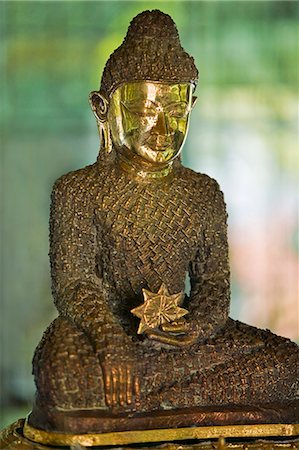 Myanmar,Burma,Rakhine State,Sittwe. The 18-inch-high Bronze Buddha at Lawkanandar Pagoda is claimed to be 2,000 years old. It has clothing made up of 1,162 small Budhha images. Stock Photo - Rights-Managed, Code: 862-03365335