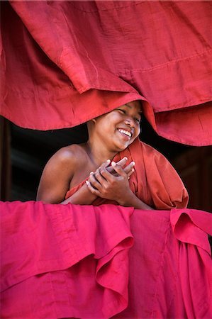photos of young monks - Myanmar,Burma,Rakhine State,Sittwe. A young novice monk at the Pathain Monastery where 210 monks live. 10% of the country’s population are monks or nuns and live off the community. Stock Photo - Rights-Managed, Code: 862-03365330