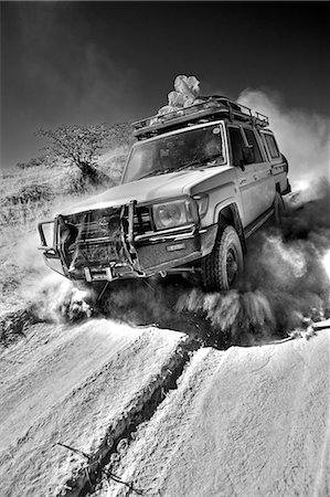 dirt roads in africa - Namibia,Damaraland. The desert environment and lack of paved roads in many the interior region means that the most travel is by four wheel drive vechicles. Stock Photo - Rights-Managed, Code: 862-03365378