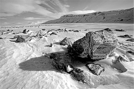 Norway,Troms,Lyngen Alps. High on the plateau,the pressure of freezing and the weather conditions,create dramatic patterns on the flat surfaces of the area's lakes. Stock Photo - Rights-Managed, Code: 862-03365604