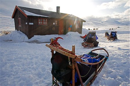 snow sledge - Norway,Tromso,Lyngen Alps. A remote mountain hut in the Lyngen Alps provide much needed shelter from the extreme winter cold Stock Photo - Rights-Managed, Code: 862-03365641