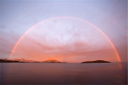 simsearch:862-03365677,k - Norway,Nordland,Helgeland. A rainbow at midnight,looking across a wide bay a rain shower at midnight creates a vivid rainbow across the water Stock Photo - Rights-Managed, Code: 862-03365673