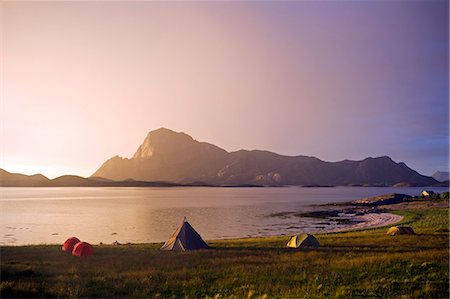 Norway,Nordland,Helgeland. The midnight sun over a kayakers camp and the peak of Rodoylova on Rodoy island Stock Photo - Rights-Managed, Code: 862-03365692