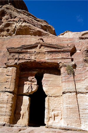 petra - Jordan,Petra. Detail of the Lion Triclinium featuring two badly eroded lions carved either side of the doorway. Stock Photo - Rights-Managed, Code: 862-03365907