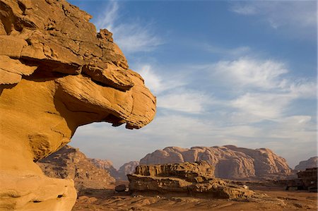 Jordan,Aqaba Region,Wadi Rum. One of the world's most spectacular desert landscapes,Wadi Rum has been a historical crossroads for Nabeatean traders heading from the Arabian Penisula,Lawrence of Arabia,and modern day adventure seekers. Stock Photo - Rights-Managed, Code: 862-03365935