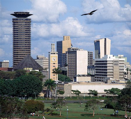 The Nairobi city skyline with Kenya's Parliament buildings in the foreground. A Black Kite (Milvus migrans) flies overhead. Stock Photo - Rights-Managed, Code: 862-03366212