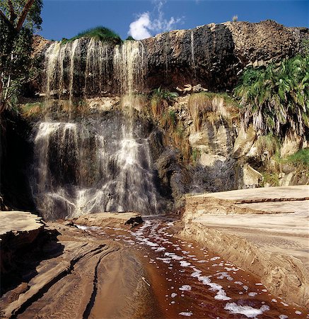 A waterfall with brackish water flows from a swamp in Shaba National Reserve,a beautiful area adjacent to the Samburu National Reserve in Northern Kenya. Stock Photo - Rights-Managed, Code: 862-03366384