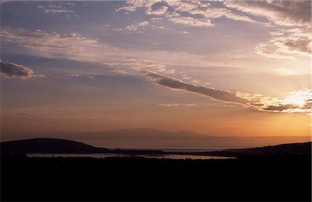 simsearch:862-03437081,k - Sunrise over Lake Naivasha with the Aberdare Mountains rising to a height of 13,000 feet in the distance. Lake Naivasha is the highest lake of Africa's Great Rift Valley and has the reputation as an ornithologist's paradise. Stock Photo - Rights-Managed, Code: 862-03366388