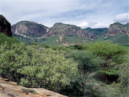 simsearch:862-03355180,k - Sheer rock faces of the impressive Ndoto Mountains near Ngurunit in Samburuland.The region is home to the Samburu people of Northern Kenya who are a semi-nomadic pastoral community related to their more famous cousins,the maa speaking Maasai. Stock Photo - Rights-Managed, Code: 862-03366418