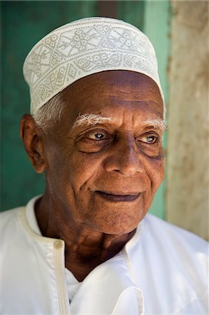 simsearch:862-03366742,k - Kenya,Lamu Island,Lamu. An old resident of Lamu town dressed in his kofia or embroidered Muslim hat. Stock Photo - Rights-Managed, Code: 862-03366730