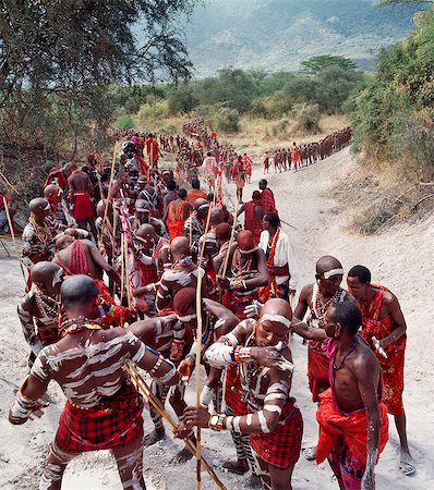 red ochre - Africa,Kenya,Kajiado District,Ol doinyo Orok. A large gathering of Maasai warriors daub themselves with white clay during an Eunoto ceremony when the warriors become junior elders and thenceforth are permitted to marry. Stock Photo - Rights-Managed, Code: 862-03366853