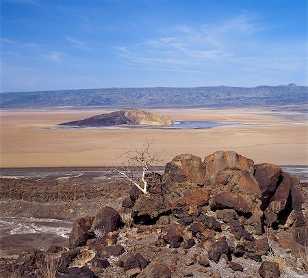 Kenya,Turkana,Suguta Valley. The Cathedral, a prominent rock at the northern end of the Suguta Valley  which is surrounded by seasonal lake,mud or friable soil depending on the time of year and rainy season. Stock Photo - Rights-Managed, Code: 862-03366947