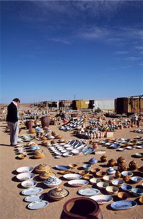 Tourist shopping at a Pottery stall alongside the road from Tripoli to Gharyan which is famous for its pottery. Stock Photo - Rights-Managed, Code: 862-03367135