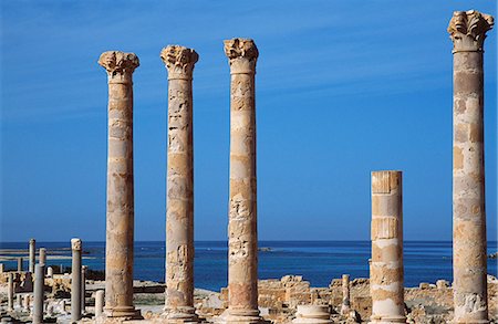 Temple of Isis built in the 1st century AD at the ancient Roman city of Sabratha. It faces the Mediterranean in keeping with its dedication to the Egyptian goddess Isis,seen here as the protector of sailors Stock Photo - Rights-Managed, Code: 862-03367138