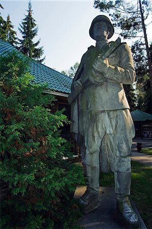 exhibitions images exterior - Lithuania,Druskininkai. A memorial statue of soldier in Gruto Parkas near Druskininkai - a theme park with Soviet sculpture collections of Lenin and Stalin. Stock Photo - Rights-Managed, Code: 862-03367215